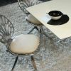 Quasar Khanh  diseño orgánico silla fundición de aluminio y cuero
